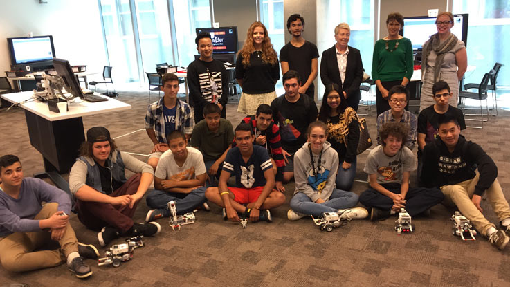 a group of tertiary students together posing at university